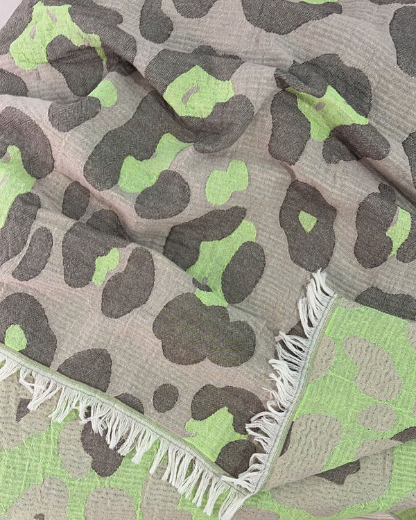 Close-up of the cotton weave and fringes of the Towel to Go Quick Dry Cotton Towel Grey and Lime from the Neon Safari collection.