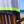 Close-up of the Grey & Charcoal 2-in-1 Beach Towel Bag on a wooden chair by the sea