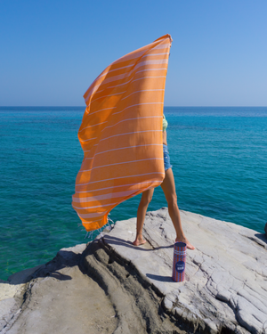 Towel to Go Ipanema in Orange quick-dry beach towel.