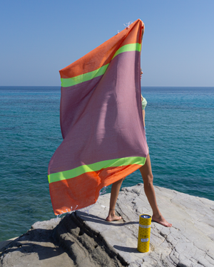 Towel to Go Neon in Pink and Red quick-dry beach towel.