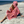 Woman using a Towel to Go Hooded Cotton Beach Poncho in Camel and Rose from the Neon Safari on the beach 2.