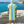 Man using a Towel to Go Hooded Cotton Beach Poncho in Blue and Lime from the Coral Coast on the beach 2.