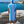 Man using a Towel to Go Hooded Cotton Beach Poncho in Blue and Navy from the Coral Coast on the beach 2.