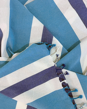 Close-up of the cotton weave and fringes of the Towel to Go Quick Dry Cotton Towel Blue and Navy from the Coral Coast collection.