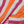 Close-up of the cotton weave and fringes of the Towel to Go Quick Dry Cotton Towel Orange and Fuchsia from the Coral Coast collection.
