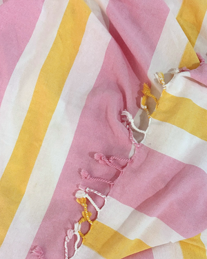 Close-up of the cotton weave and fringes of the Towel to Go Quick Dry Cotton Towel Rose and Sunset from the Coral Coast collection.