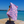 Woman using a Towel to Go Quick Dry Cotton Towel in Lavender and Coral from the Neon Safari on the beach 2.