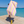Woman using a Towel to Go Quick Dry Cotton Towel in Rose and Sunset from the Coral Coast on the beach.