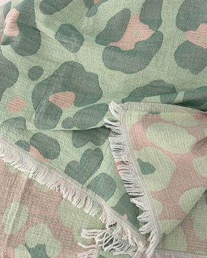 Close-up of the cotton weave and fringes of the Towel to Go Quick Dry Cotton Towel Sage and Blush from the Neon Safari collection.